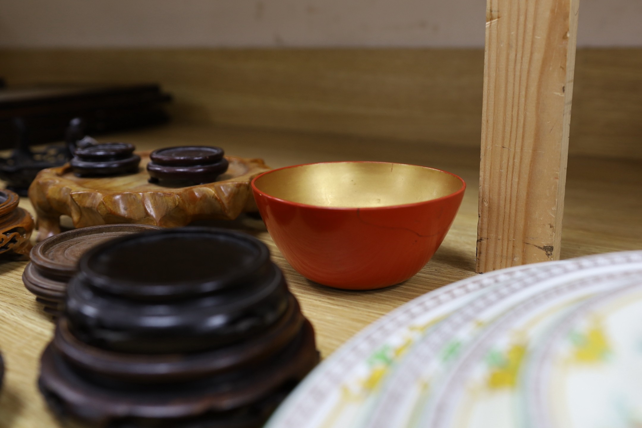 Assorted Chinese wooden stands and a lacquer bowl